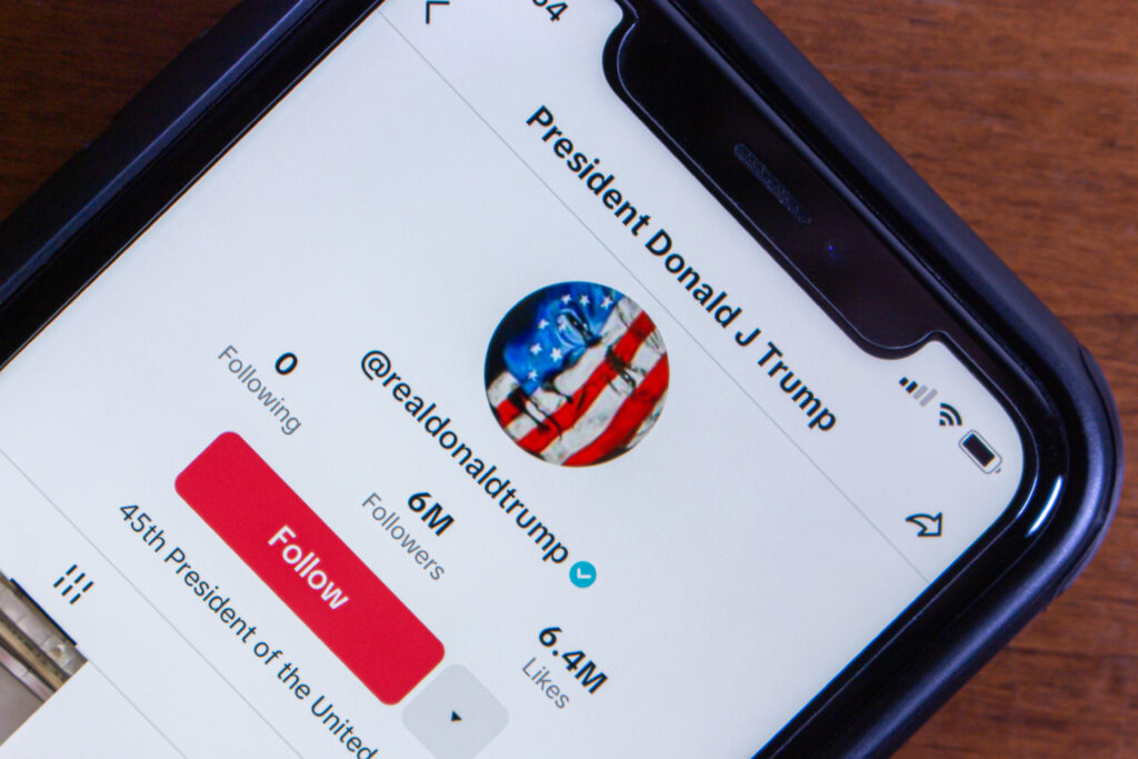 President Donald J Trump social media account (@realdonaldtrump) seen in an iPhone screen.