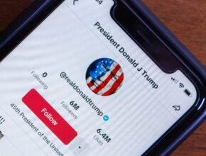 President Donald J Trump social media account (@realdonaldtrump) seen in an iPhone screen.